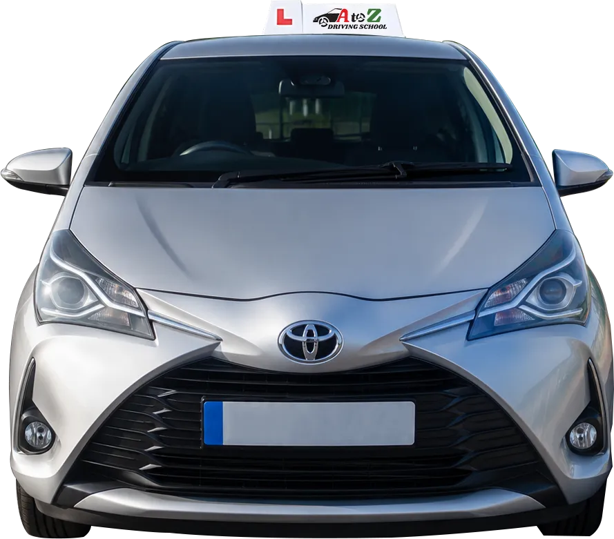 Close-up front view of a silver driving school car.